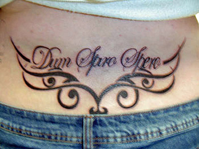 cross tattoos designs for girls. Lower Back Cross Tattoo Design