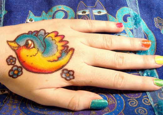 Rainbow Bird Sharpie Tattoo on Hand for Summer