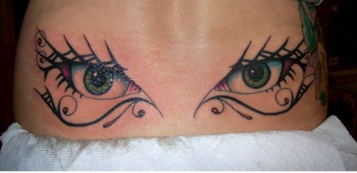 Eyes Tribal Tattoo Designs on Lower Back 2014